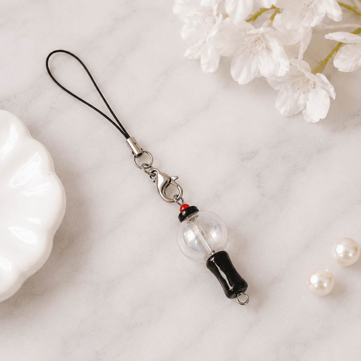 Mini ARMY Bomb Phone & Bag Charm Attached to a Pink Handbag