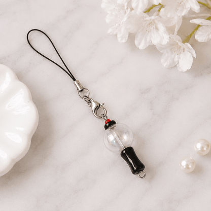 Mini ARMY Bomb Phone & Bag Charm Attached to a Pink Handbag